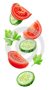 Flying slices of tomato and cucumber