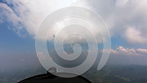 Flying small propeller airplane in turbulence, light sport airplane flying through clouds