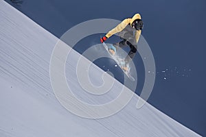 Flying snowboarder on mountains