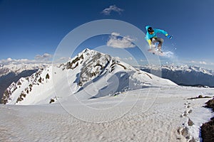 Flying snowboarder on mountains, extreme sport