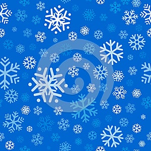 Flying snowflakes, snow seamless pattern on light blue background. Winter abstract on blue sky. Christmas and new year backdrop.