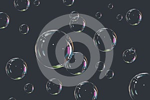 Flying soap bubbles on a dark background