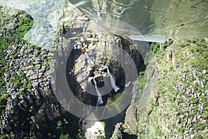 Flying towards waterfall POV from light aircraft window Kakadu National Park