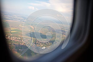 Flying and traveling, view from airplane window on the wing