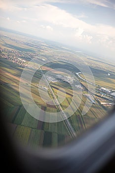 Flying and traveling, view from airplane window on the wing