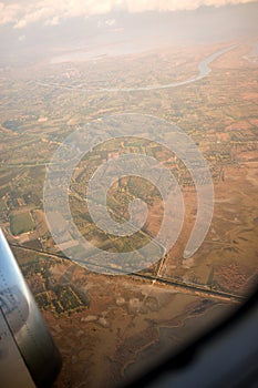 Flying and traveling, view from airplane window on the wing