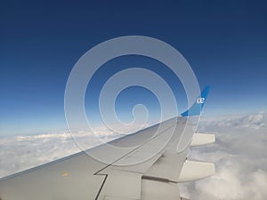 flying and traveling, view from airplane window on the wing on sunset time