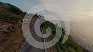 Flying tropical island mountain sea evening landscape countryside road tourist people aerial view