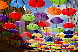 Flying umbrella on the street