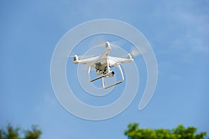 Flying unmanned quadcopter with video camera