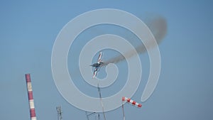 Flying of vintage propeller biplane in air. Winged propeller airplane passing in the clear blue sky during flight