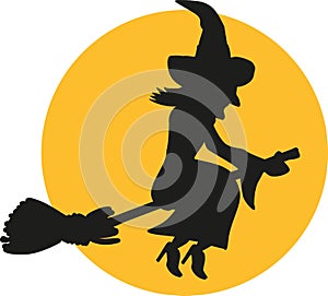 Flying witch silhouette at night in front of the moon