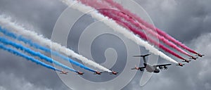 Flypast of RAF Red Arrows escorting an Airbus A400M
