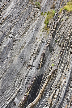 Flysch dramatic rock formation Cantabric coastline in Zumaia, Euskadi