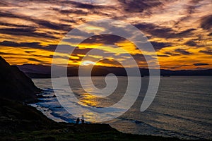 Flysch rocks in Barrika beach at the sunset, Basque Country photo