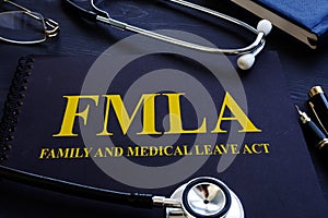 FMLA family and medical leave act and stethoscope. photo