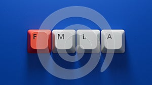 FMLA word written on Computer keyboard keys with copy space.close up of Computer keyboard keys