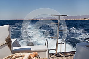 Foam astern of a moving ship at sea