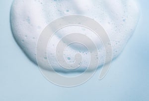 Foam background. Liquid soap bubbles, Froth bubbles backdrop. Soap foam popping bubble, white backdrop