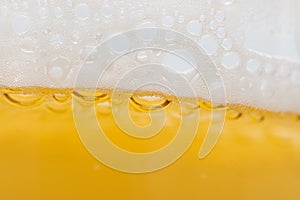 Foam with beer bubbles as background