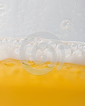 Foam with beer bubbles as background