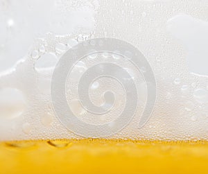 Foam with beer bubbles as background