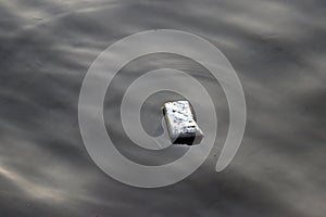 Foam garbage floating on the sewage water