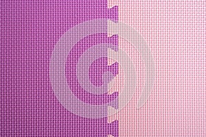 Foam rubber tile in pink and purple color, top view