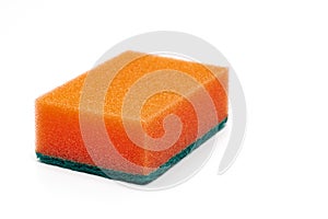 Foam sponge of orange color with abrasive material used daily by all housewives to clean house