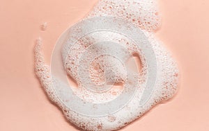 foam texture on the skin. Cleansing and skin care, soap, shampoo. Macro photography with bubbles