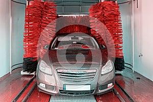 Foam water clean auto car on carwash hand service. Vehicle wash soap, foam on cleaner station. Automatic care, waxing