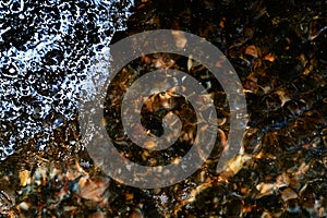 Foam on the water. Dark water