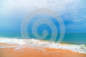 Foam wave, running on the sandy shore