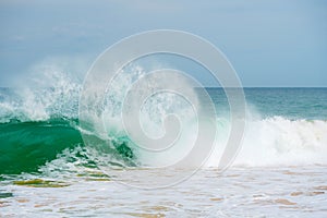 Foam wave, running on the sandy shore