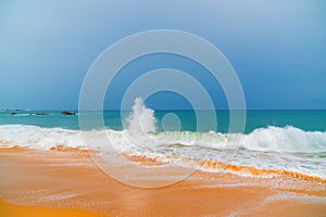 Foam wave, running on the sandy shore