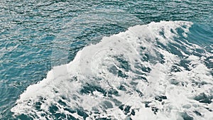 Foam wave of the sea surface from the movement of the ferry. View of the exciting sea of the Palawan Islands. Shooting