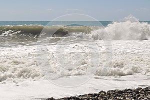 Foam and waves in the sea on a sunny day