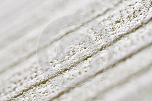 Foamed surface construction finishing material. Diagonal background