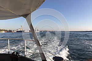 Foams on the surface of the city passenger ferry and sea on the move. View of Istanbul harbor away from Kadikoy