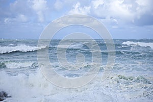 Foamy stong waves crashing in the ocean