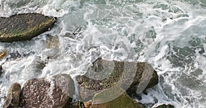 Foamy Waves Hitting The Rocks