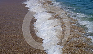 Summer, sea, sun, beach, holiday, fun. Foamy waves on the seashore - Black Sea, landmark attraction in Romania