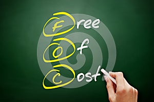 FOC - Free Of Cost acronym, business concept on blackboard photo