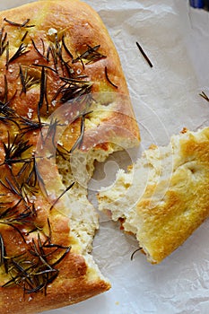 Focaccia bread decorated with salt and rosemary