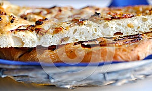 Focaccia bread detail with onions and thyme