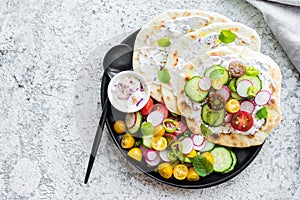 Focaccia with sauce and colorful vegetables