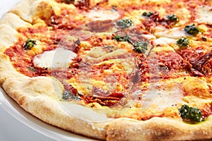 Focaccia with sun dried tomatoes and mozzarella closeup