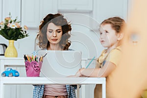 Focus of adorable child drawing near