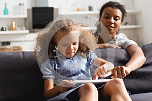 Focus of african american nanny pointing