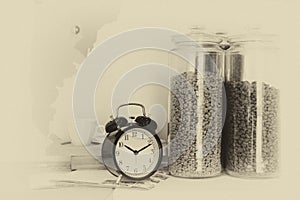 Focus alarm clock with coffee beans in glass bowl and coffee cu